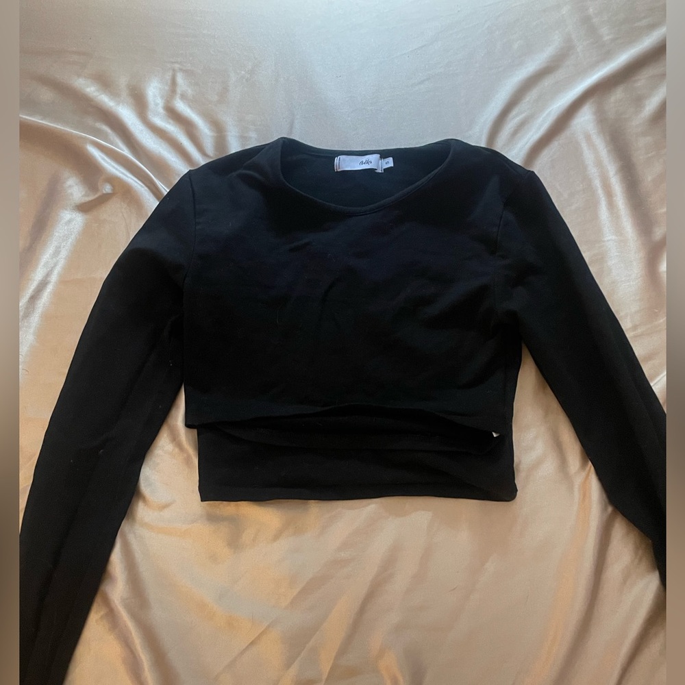 Black long sleeve with cut out from Adika.
